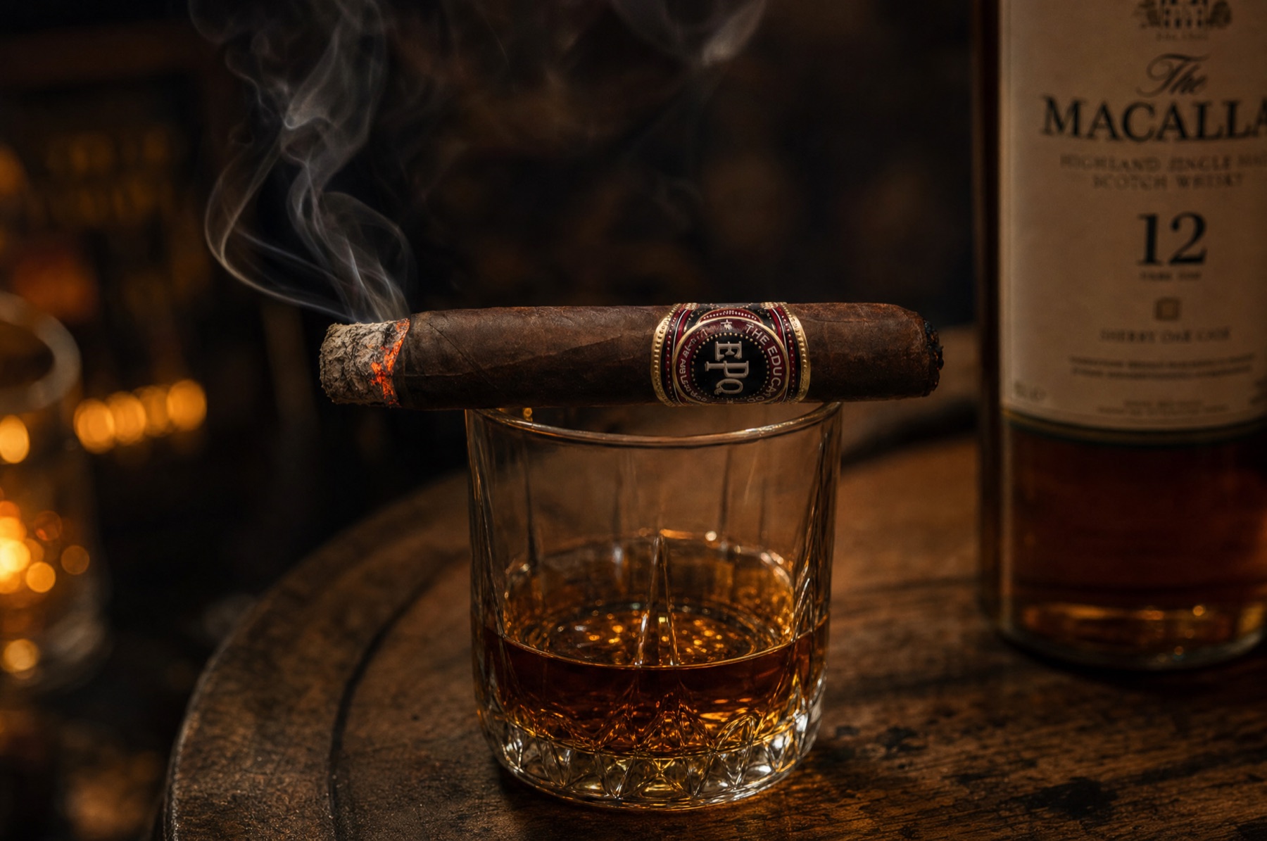 The Educator resting across a whisky glass beside a bottle of single malt